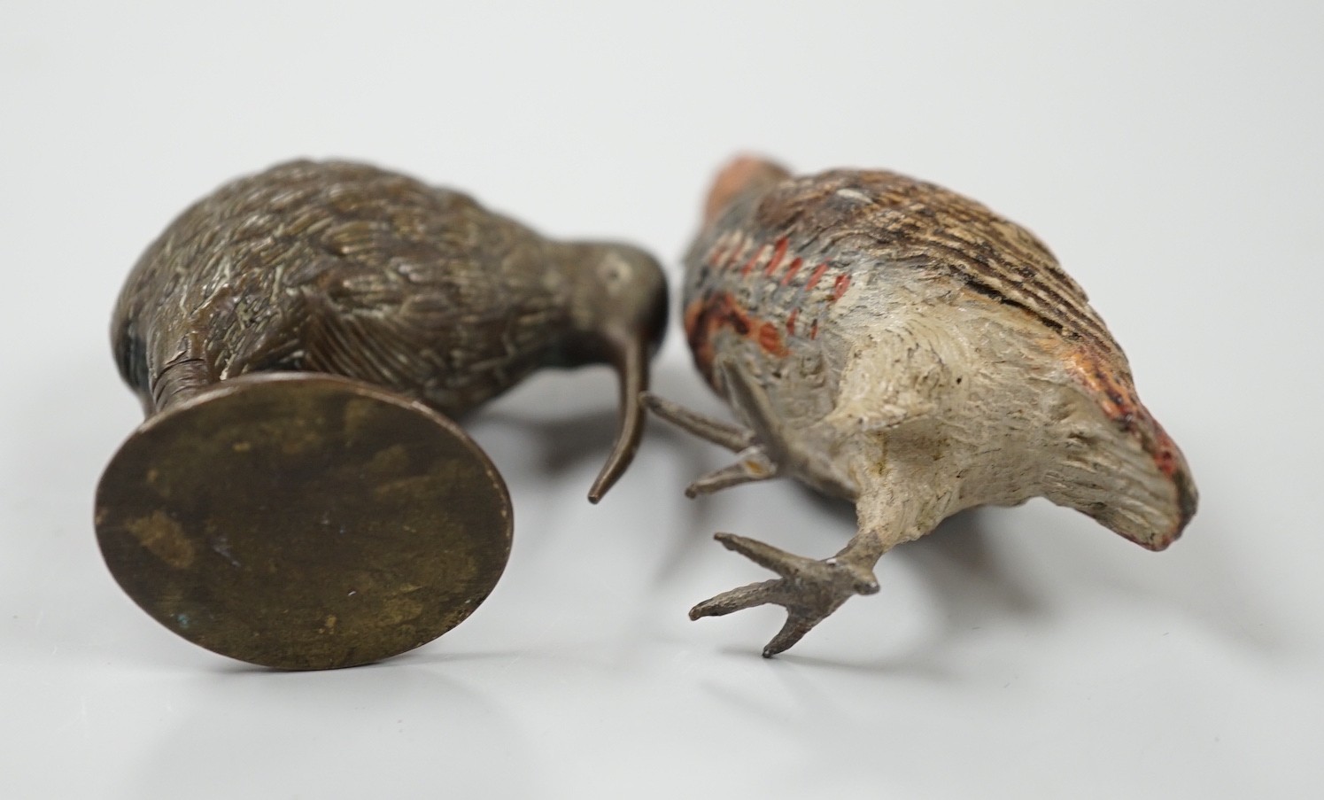 A cold painted bronze model of a ptarmigan and a bronze model of a kiwi. Tallest 5.5cm